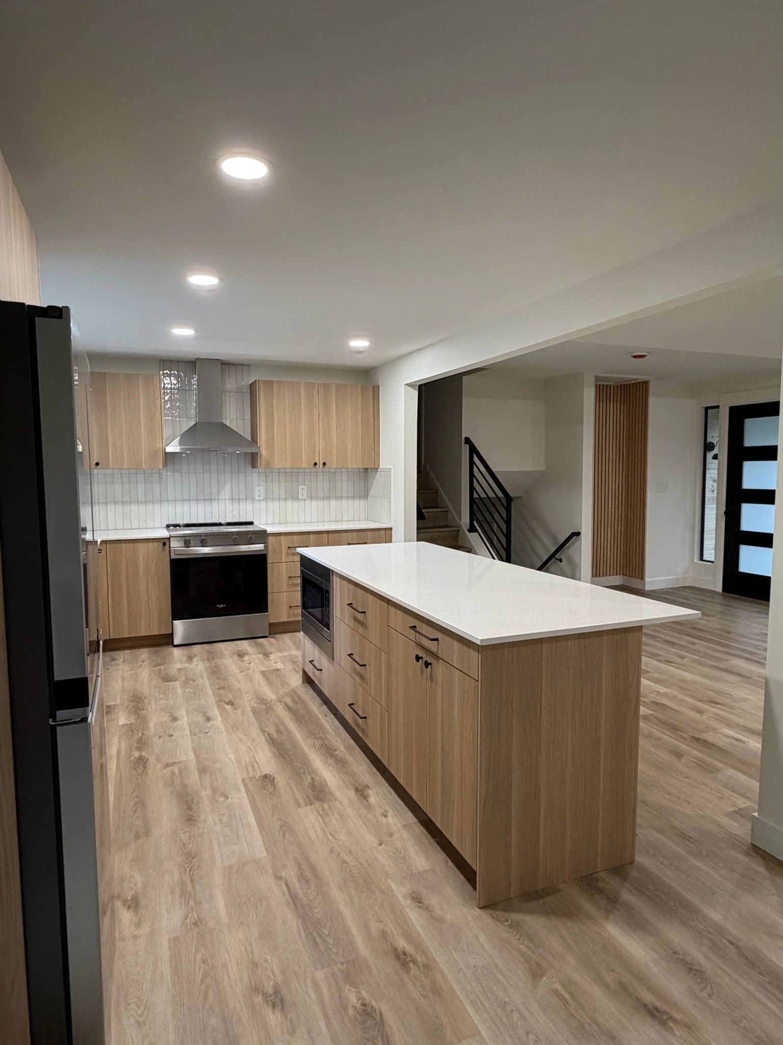 Remodeled kitchen with stainless range and wood island