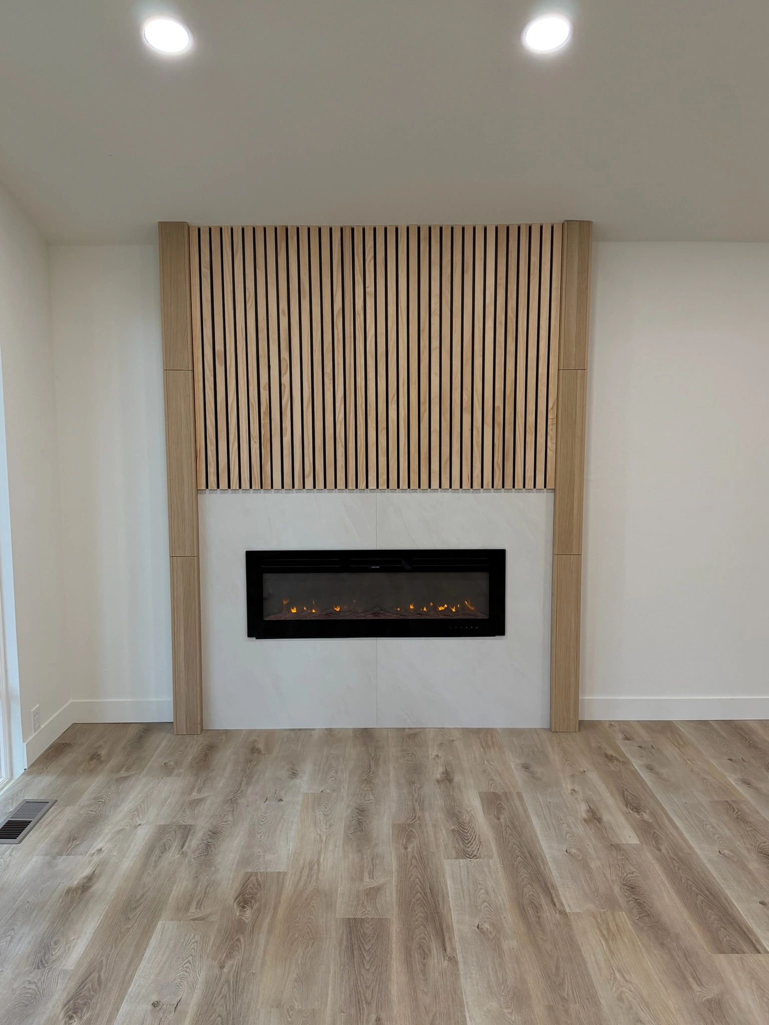 Living room fireplace wall with wood slat panels
