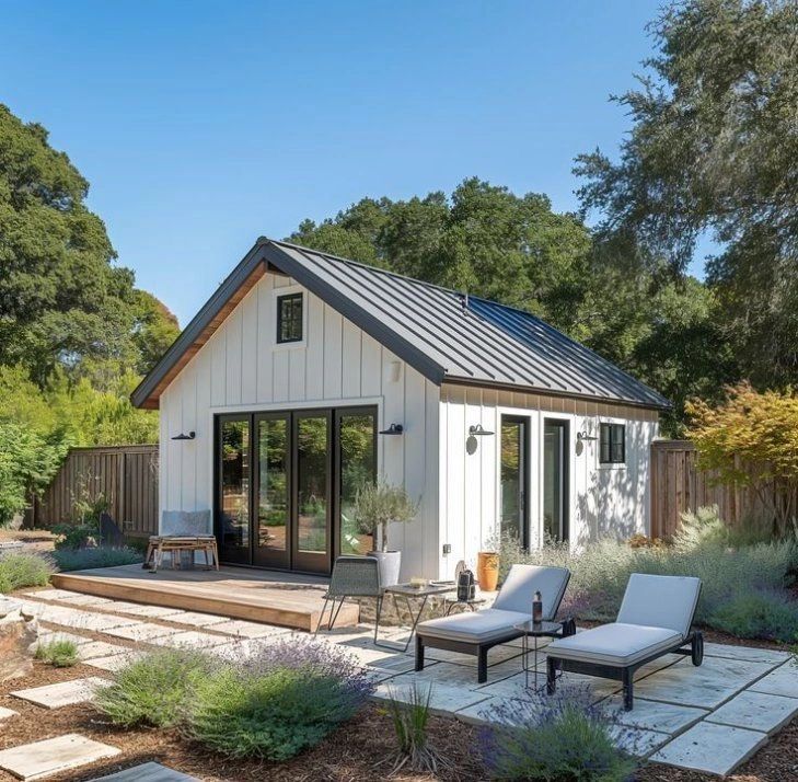Backyard cottage with patio and lounge chairs