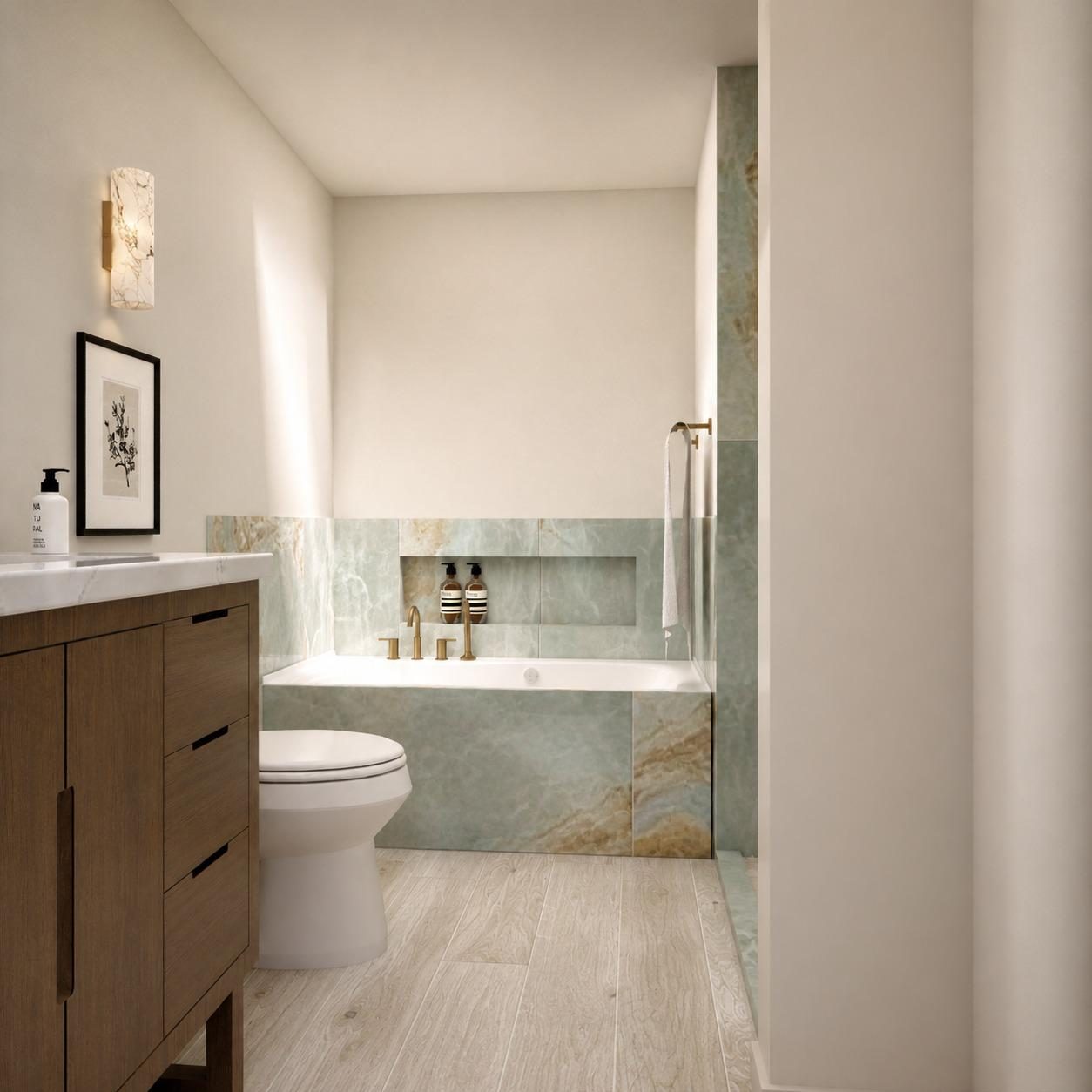 Bathtub with green onyx surround, brass filler and walnut vanity